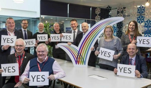 group of people voting to yes to extend the Manor Royal Business Improvement District (BID)